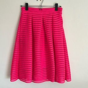 Neon pink below knee length skirt